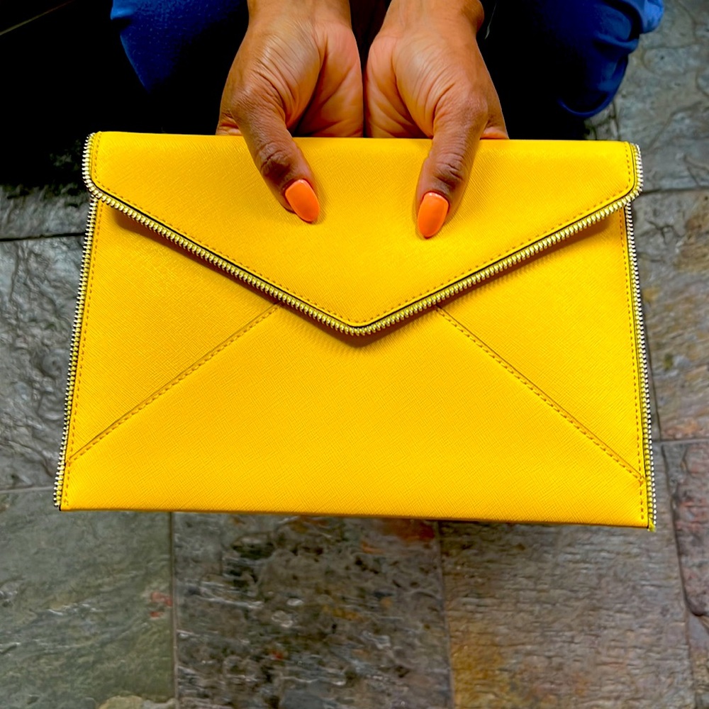 Nearly new yellow envelope clutch with zipper detail